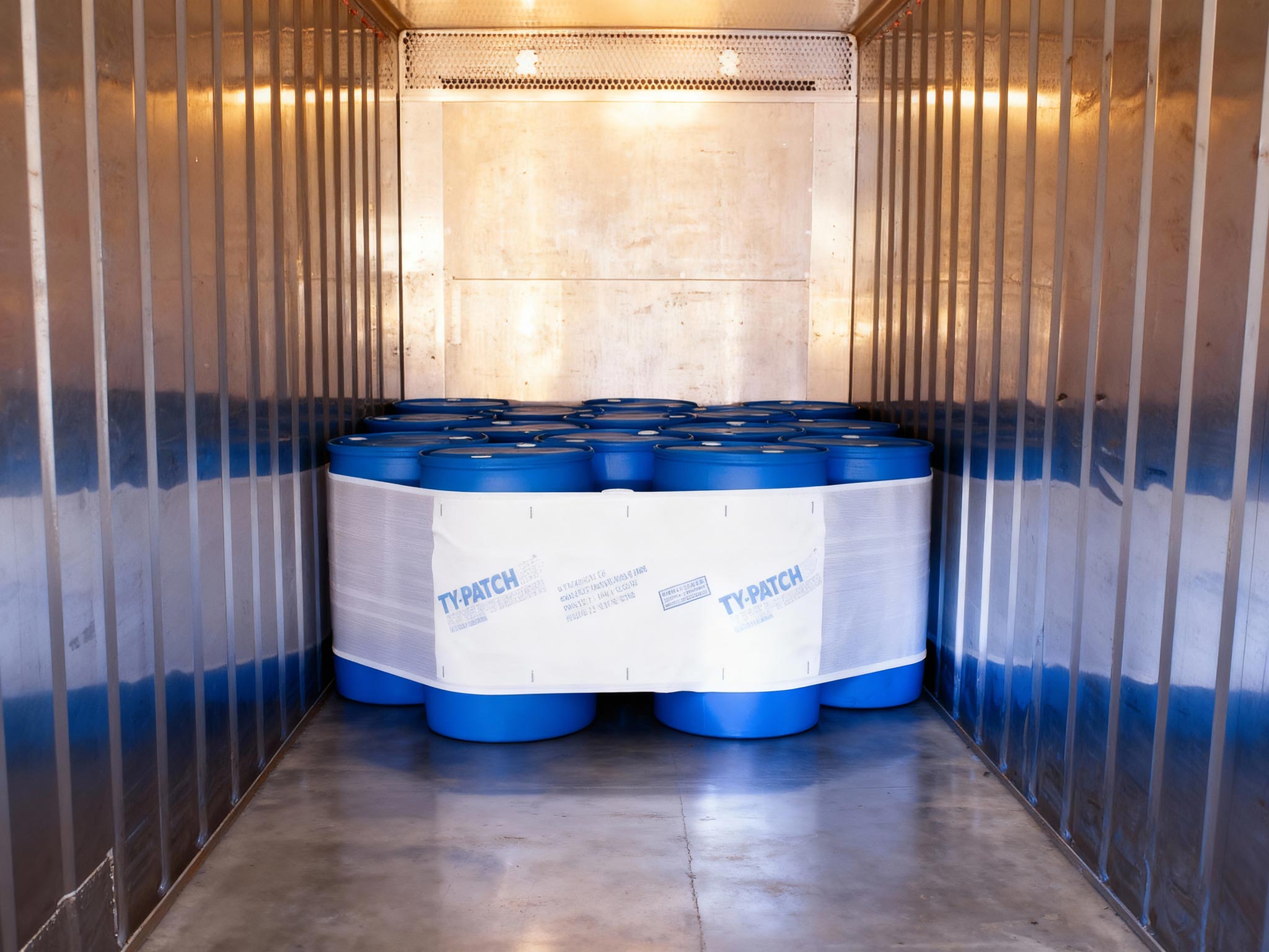 Drums restrained in a container